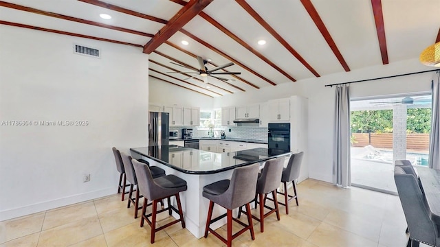 9925 SW 82nd Ave, Miami, FL 33156 - kitchen with ceiling fan, freestanding refrigerator, stainless steel dishwasher, a kitchen breakfast bar, and recessed lighting