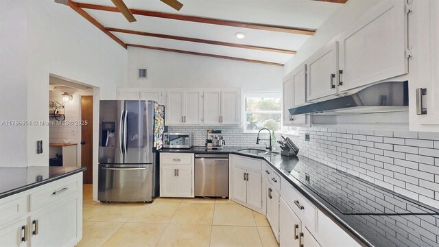 9925 SW 82nd Ave, Miami, FL 33156 - kitchen with stainless steel appliances, decorative backsplash, dark countertops, light tile patterned flooring, and white cabinetry
