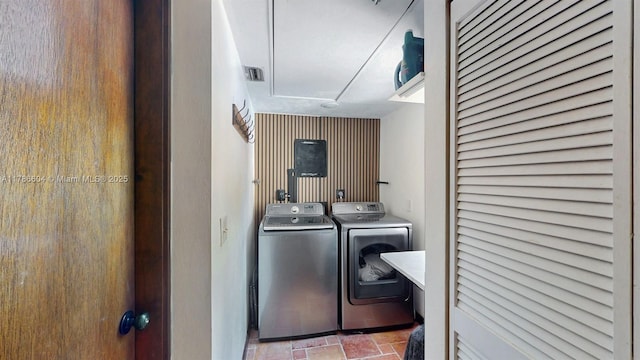 9925 SW 82nd Ave, Miami, FL 33156 - laundry room featuring independent washer and dryer, attic access, and stone finish floors