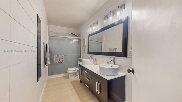 9925 SW 82nd Ave, Miami, FL 33156 - full bathroom with a shower stall, double vanity, and wood finished floors