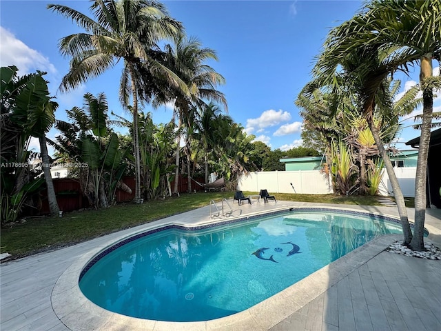 5424 Garfield St, Hollywood, FL 33021 - view of swimming pool featuring a lawn, a fenced backyard, a fenced in pool, and a patio area