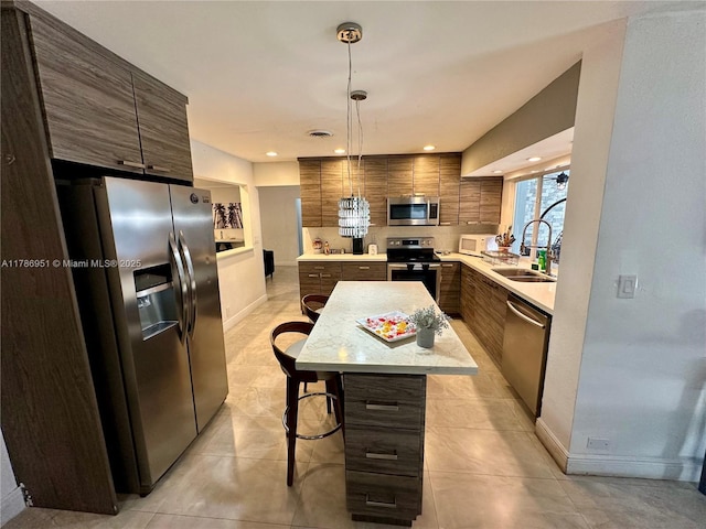 5424 Garfield St, Hollywood, FL 33021 - kitchen with decorative backsplash, a sink, stainless steel appliances, light countertops, and modern cabinets