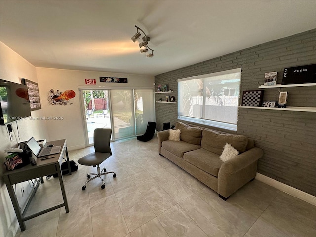 5424 Garfield St, Hollywood, FL 33021 - office featuring a healthy amount of sunlight, brick wall, and baseboards