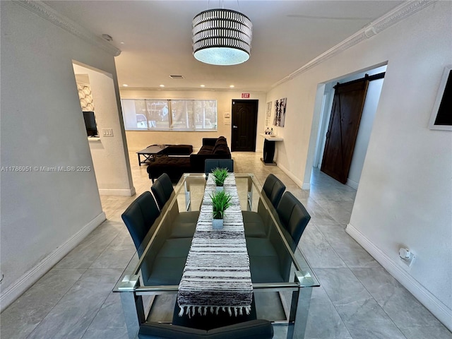 5424 Garfield St, Hollywood, FL 33021 - dining area featuring baseboards, a barn door, and ornamental molding