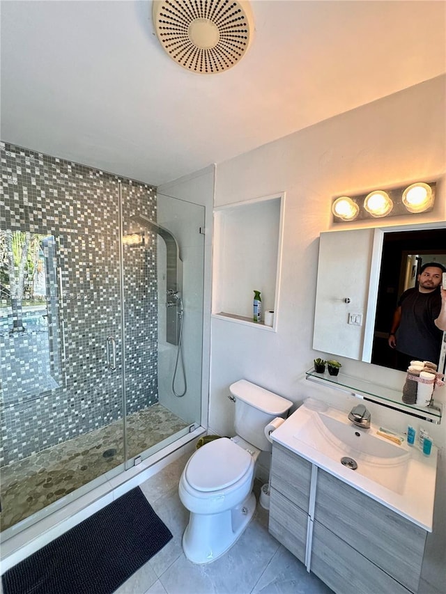 5424 Garfield St, Hollywood, FL 33021 - bathroom with toilet, tile patterned floors, a shower stall, and vanity