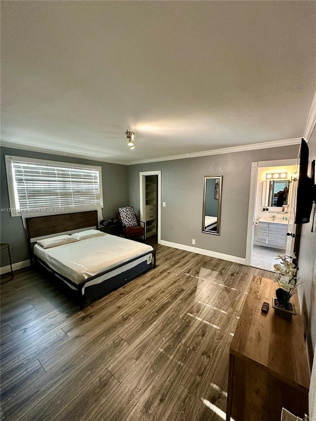 5424 Garfield St, Hollywood, FL 33021 - bedroom featuring baseboards, wood finished floors, ensuite bath, and crown molding