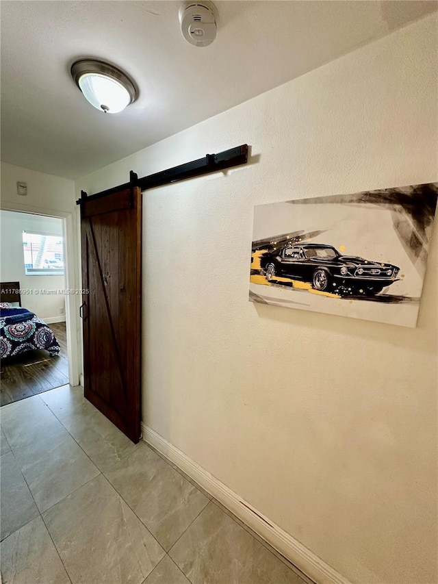 5424 Garfield St, Hollywood, FL 33021 - hall with a barn door and baseboards