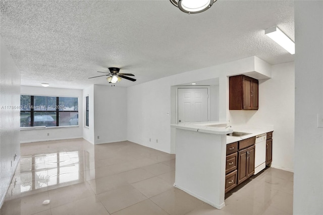 kitchen with light countertops, dishwasher, a ceiling fan, a textured ceiling, and open floor plan