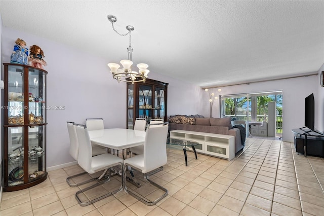 3800 Hillcrest Dr Unit 210, Hollywood, FL 33021 - dining area featuring a textured ceiling, a chandelier, and light tile patterned floors