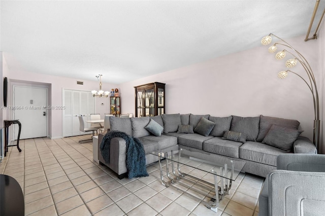 3800 Hillcrest Dr Unit 210, Hollywood, FL 33021 - living area featuring a chandelier and light tile patterned floors