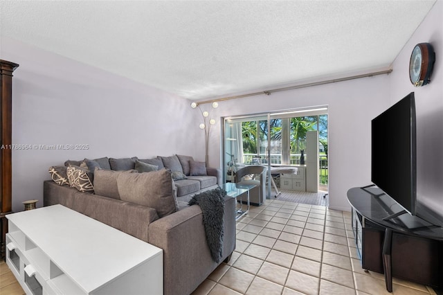 3800 Hillcrest Dr Unit 210, Hollywood, FL 33021 - living room with a textured ceiling and light tile patterned floors