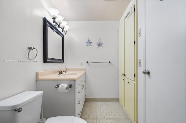 3800 Hillcrest Dr Unit 210, Hollywood, FL 33021 - bathroom with vanity, toilet, and tile patterned floors