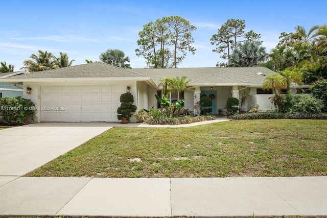 710 Daffodil Dr, Wellington, FL 33414 - single story home with driveway, a front lawn, stucco siding, and an attached garage