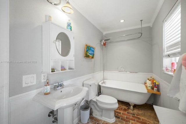 710 Daffodil Dr, Wellington, FL 33414 - full bath with a wealth of natural light, a freestanding tub, ornamental molding, and a wainscoted wall