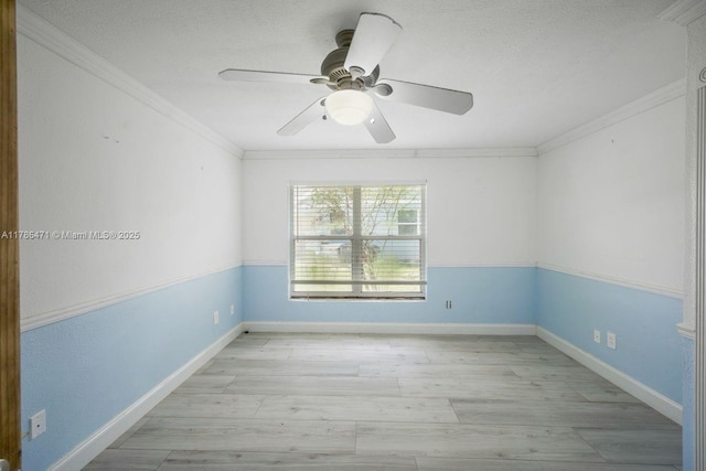 710 Daffodil Dr, Wellington, FL 33414 - empty room featuring ceiling fan, crown molding, baseboards, a textured ceiling, and wood finished floors