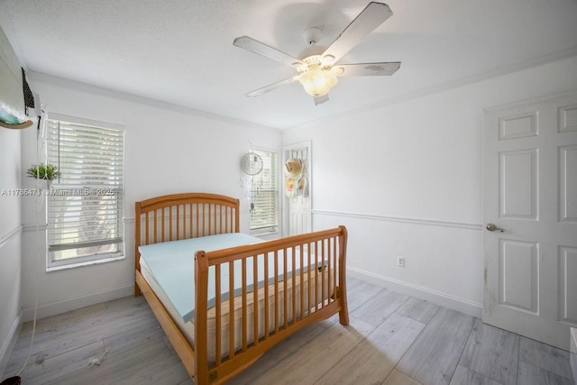 710 Daffodil Dr, Wellington, FL 33414 - bedroom featuring wood finished floors, ceiling fan, and baseboards