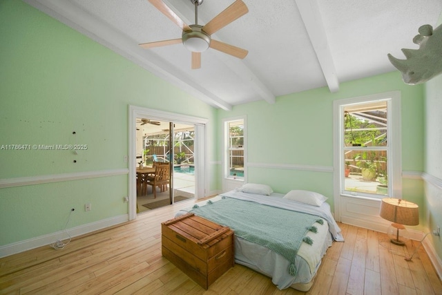 710 Daffodil Dr, Wellington, FL 33414 - bedroom featuring access to exterior, light wood-style flooring, vaulted ceiling with beams, and multiple windows