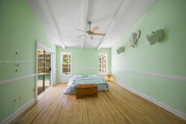 710 Daffodil Dr, Wellington, FL 33414 - bedroom featuring beamed ceiling, access to exterior, baseboards, wood finished floors, and a ceiling fan