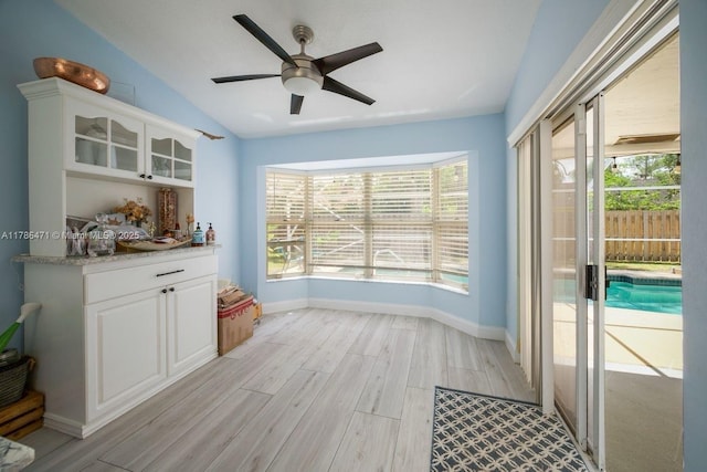 710 Daffodil Dr, Wellington, FL 33414 - interior space featuring baseboards, light wood-type flooring, ceiling fan, and lofted ceiling