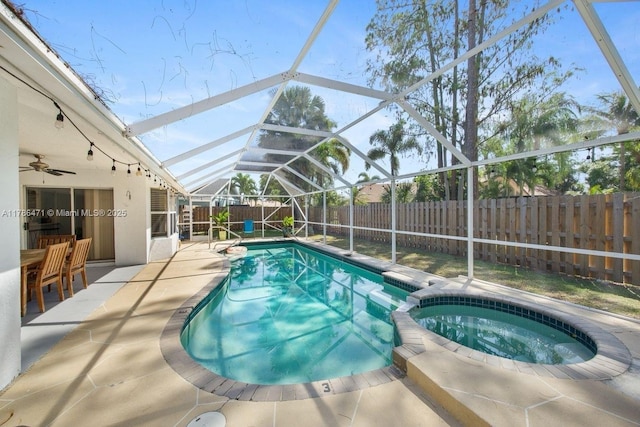 710 Daffodil Dr, Wellington, FL 33414 - view of swimming pool with a pool with connected hot tub, a patio, a fenced backyard, and a lanai