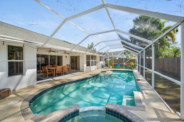 710 Daffodil Dr, Wellington, FL 33414 - view of swimming pool featuring a patio, a pool with connected hot tub, ceiling fan, a fenced backyard, and a lanai