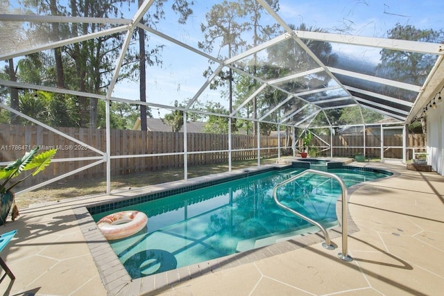 710 Daffodil Dr, Wellington, FL 33414 - view of pool featuring a patio, glass enclosure, a fenced backyard, and a pool with connected hot tub