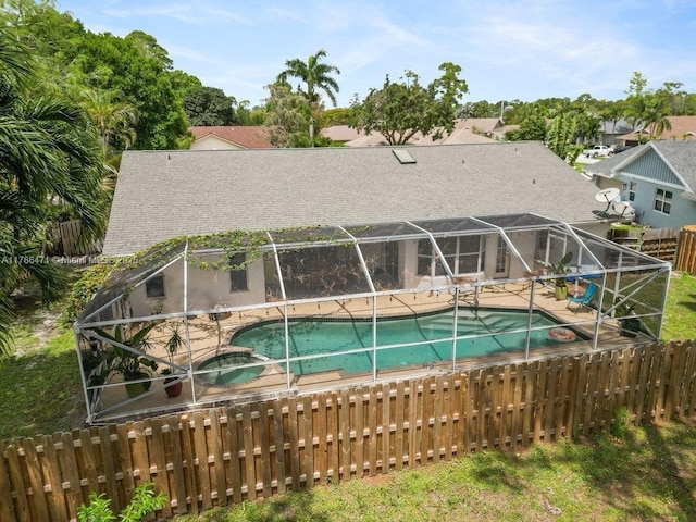 710 Daffodil Dr, Wellington, FL 33414 - view of pool with fence, a lanai, a patio area, and a pool with connected hot tub