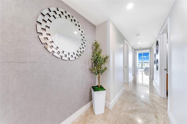 17001 Collins Ave Unit 2401, Sunny Isles Beach, FL 33160 - hallway with baseboards, recessed lighting, and marble finish floor