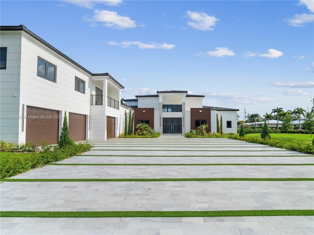 view of front of house featuring an attached garage and driveway