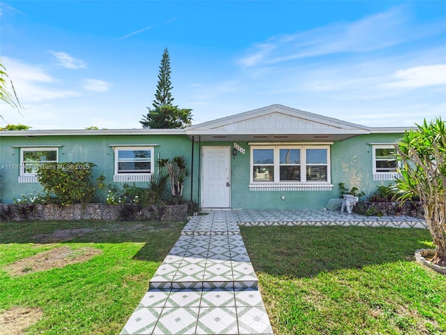 22534 SW 114th Pl, Miami, FL 33170 - view of front of house with stucco siding and a front yard