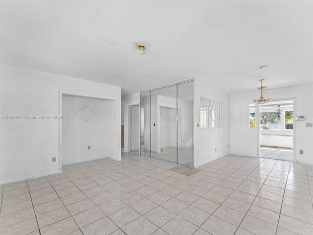 22534 SW 114th Pl, Miami, FL 33170 - unfurnished room featuring a chandelier and light tile patterned flooring