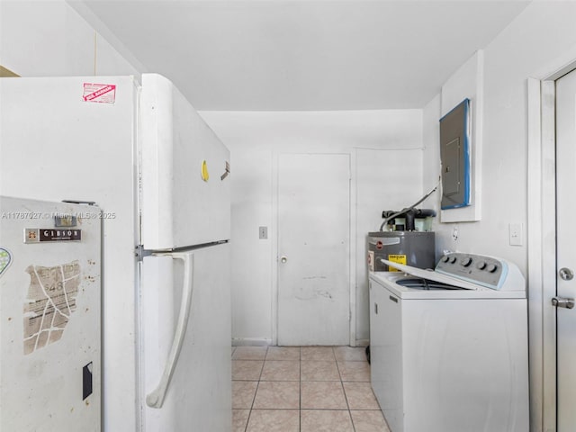 22534 SW 114th Pl, Miami, FL 33170 - washroom featuring washer / clothes dryer, water heater, electric panel, and light tile patterned floors