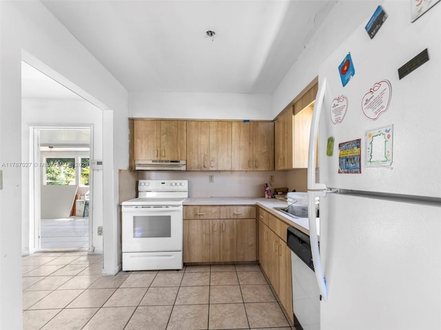 22534 SW 114th Pl, Miami, FL 33170 - kitchen with white appliances, under cabinet range hood, light countertops, and light tile patterned floors