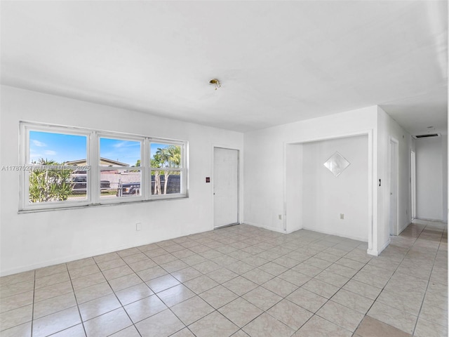 22534 SW 114th Pl, Miami, FL 33170 - spare room featuring light tile patterned floors