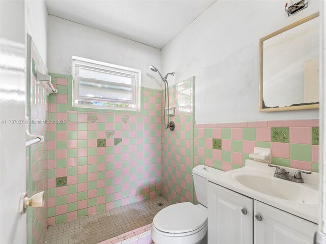 22534 SW 114th Pl, Miami, FL 33170 - full bathroom featuring a shower stall, vanity, wainscoting, and tile walls