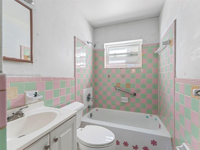 22534 SW 114th Pl, Miami, FL 33170 - full bath featuring tile walls, shower / washtub combination, vanity, and wainscoting