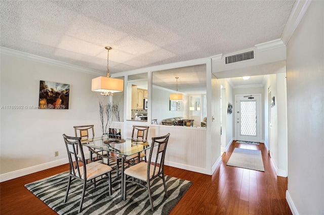 370 NW 76th Ave Unit 307, Margate, FL 33063 - dining room with ornamental molding, dark wood-style flooring, and a textured ceiling
