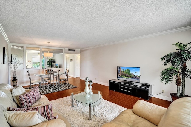 370 NW 76th Ave Unit 307, Margate, FL 33063 - living area featuring dark wood-type flooring, a textured ceiling, and ornamental molding