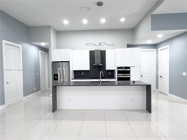 314 Chiquita Blvd N, Cape Coral, FL 33993 - kitchen featuring wall chimney range hood, dark countertops, appliances with stainless steel finishes, baseboards, and white cabinets