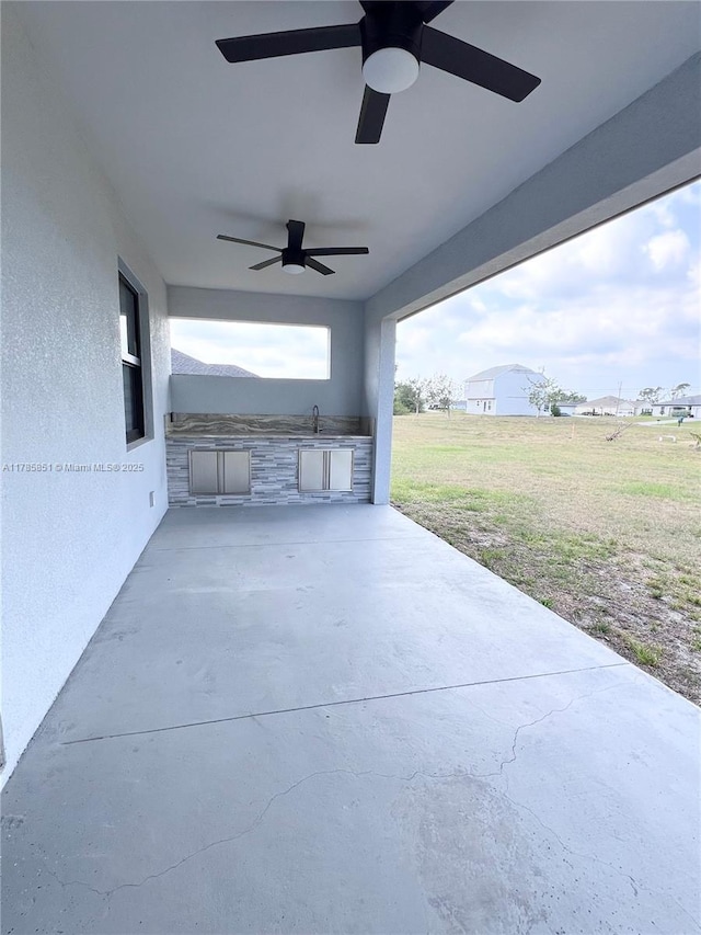 314 Chiquita Blvd N, Cape Coral, FL 33993 - view of patio with ceiling fan and an outdoor kitchen