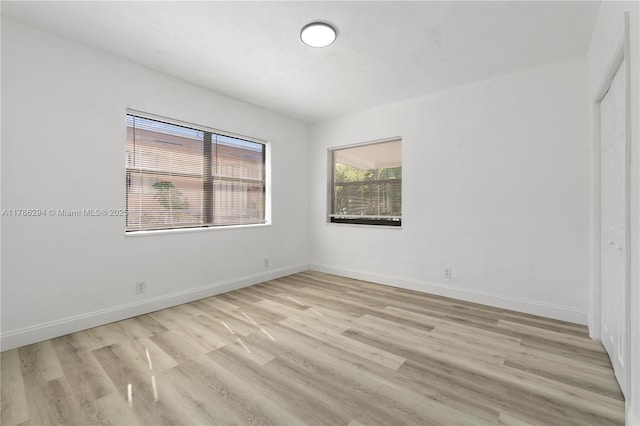 720 NW 6th St, Hallandale Beach, FL 33009 - spare room with light wood-style flooring and baseboards