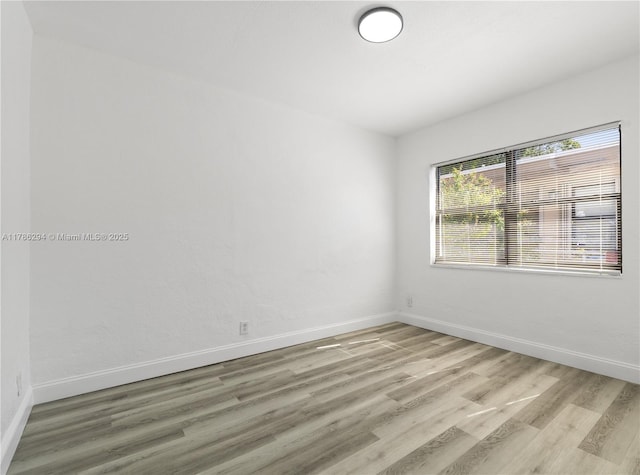 720 NW 6th St, Hallandale Beach, FL 33009 - empty room with light wood-type flooring and baseboards