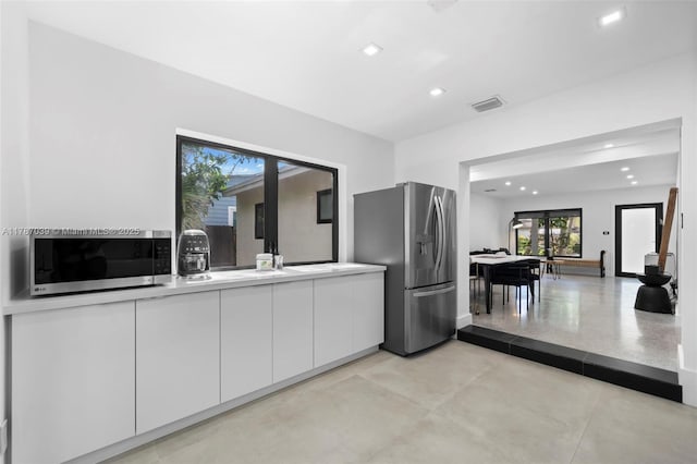 kitchen featuring white cabinets, visible vents, recessed lighting, light countertops, and appliances with stainless steel finishes