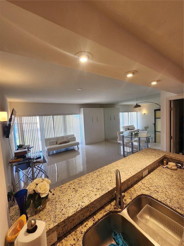 1965 S Ocean Dr Unit 3H, Hallandale Beach, FL 33009 - kitchen with a sink, healthy amount of natural light, light stone counters, and recessed lighting