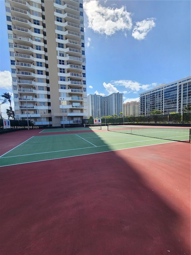 view of sport court featuring community basketball court and fence