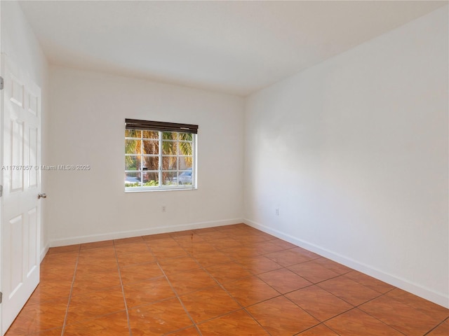 tiled spare room with baseboards