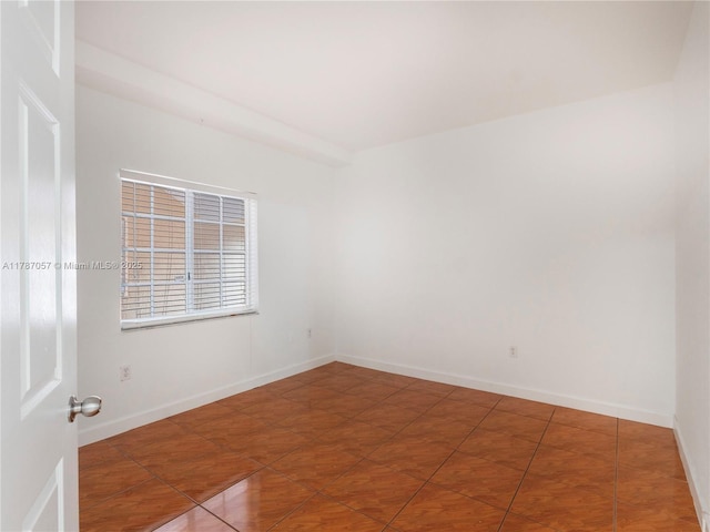 tiled spare room with baseboards