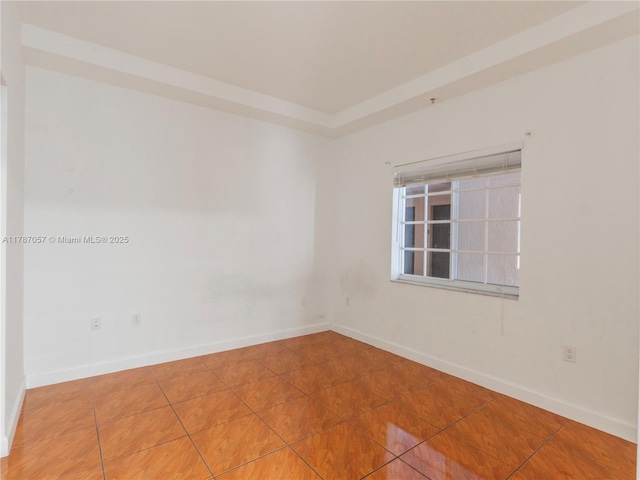 tiled empty room with baseboards