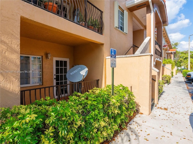 view of side of property featuring stucco siding