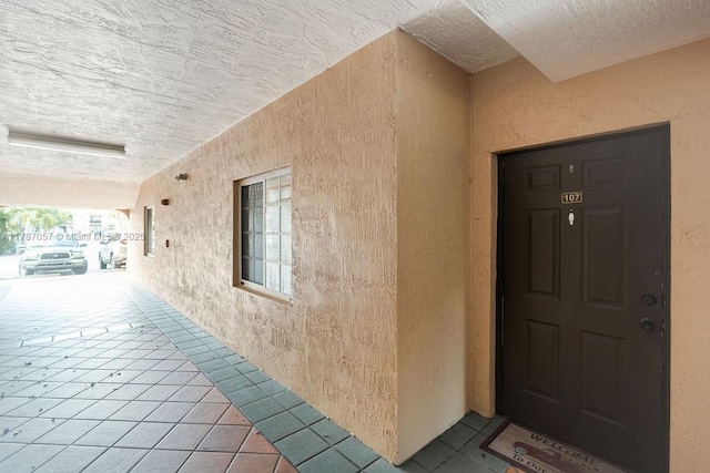 entrance to property with stucco siding